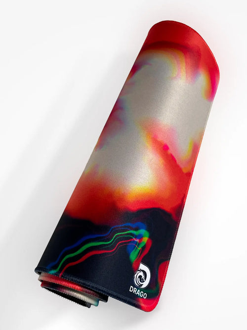 Colorful mouse pad with a swirling design on a white background, featuring the brand 'Drago'